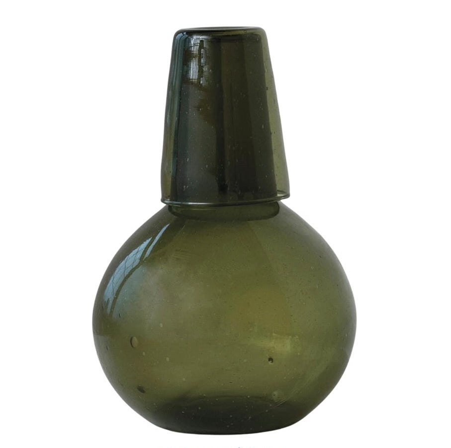 Green glass carafe with drinking glass