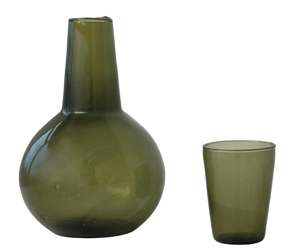 Green glass carafe with drinking glass