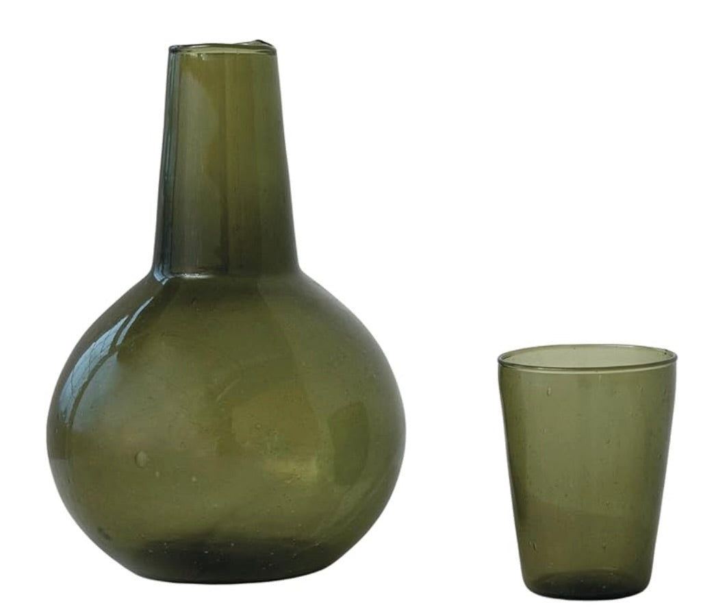 Green glass carafe with drinking glass
